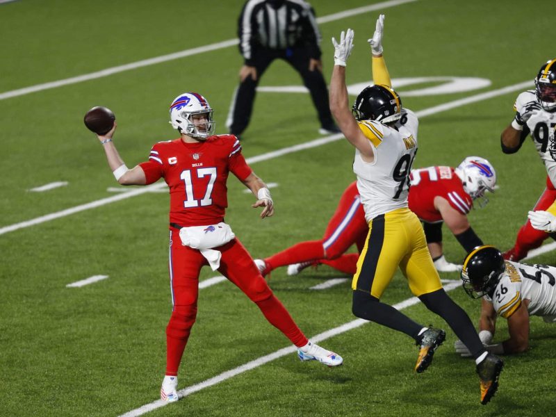 Buffalo Bills quarterback Josh Allen (17) gets off a pass under pressure by Pittsburgh Steelers outside linebacker T.J. Watt (90) during the first half of an NFL football game in Orchard Park, N.Y., Sunday, Dec. 13, 2020. (AP Photo/Jeffrey T. Barnes )